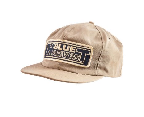 An original crew cap from the production of Star Wars: Episode IV - A New Hope (Lucasfilm Ltd., 1977). The crew cap features 
