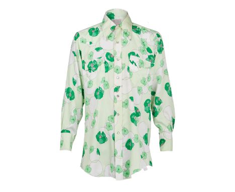 A pair of vintage floral shirts, personally-owned by Dennis Hopper.This lot includes a cotton-blend button down with a navy b