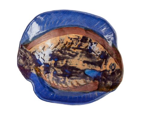 A blue and brown ceramic serving bowl designed and painted to look like a fish that was owned and possibly created by Dennis 