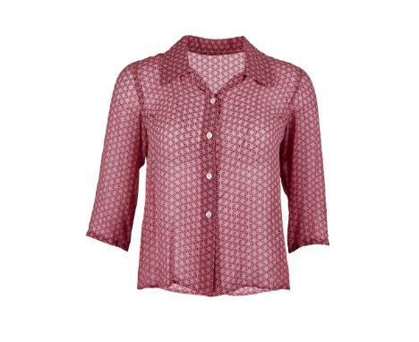 A blouse for Paz Vega as "Flor" in the romantic comedy Spanglish (Columbia Pictures, 2004).The sheer button-down blouse featu