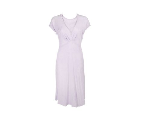 A purple, short-sleeved midi-dress with shoes as seen worn by Paz Vega as "Flor" in the romantic comedy Spanglish (Columbia P