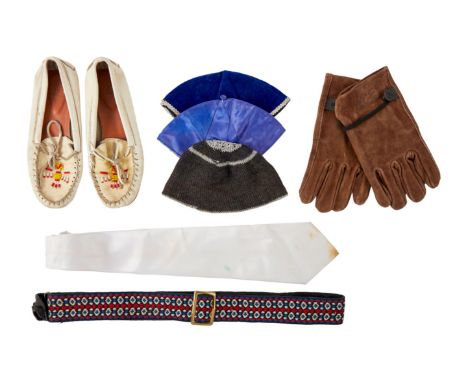 A group of clothing accessories that belonged to Dennis Hopper, including a pair of white leather moccasins with a beaded des