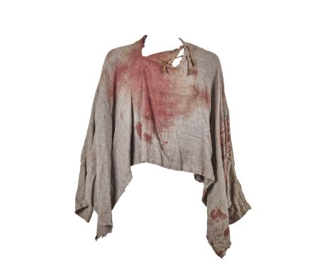 A "bloody" peasant-style top used in the production of the action/adventure The 13th Warrior (Touchstone Pictures, 1999). The