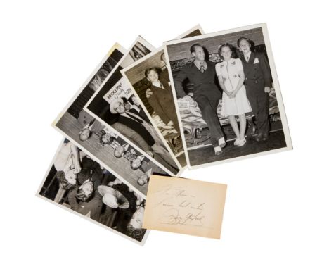 A signed handwritten note from Judy Garland, written in ink on a slip of paper, together with five vintage publicity photos (