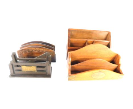 Four carved wooden letter racks, two of tiered form, one as a three bar gate.