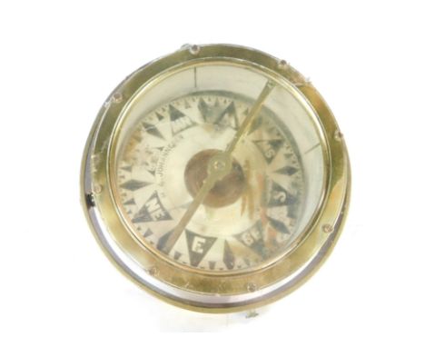 A Hau Johannesen of Grimsby brass cased gimbal compass, with a brass protected hood, 37cm diameter.