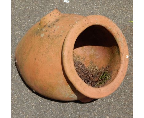 A terracotta planter shaped as an urn, 40cm high.