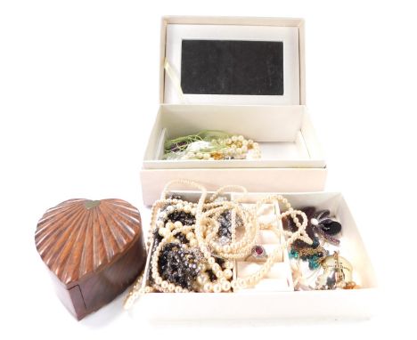 Two jewellery boxes and contents, comprising brooches, faux pearl necklaces, dress rings, etc. (a quantity)