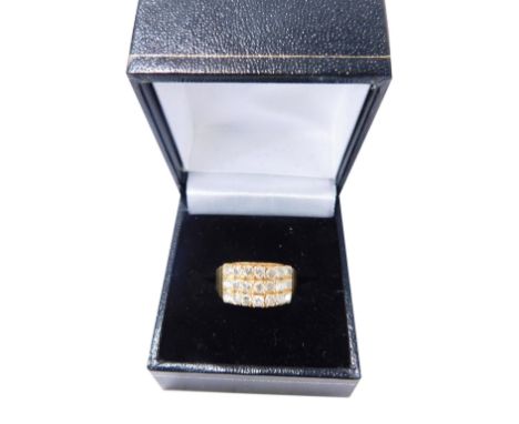 A gentleman's diamond set signet ring, with three rows of seven diamonds, on an alternating and tiered setting, with stepped 