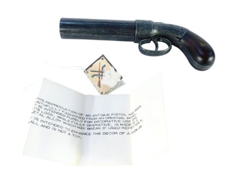 A replica antique pepper pot revolver pistol, boxed, 21cm long.