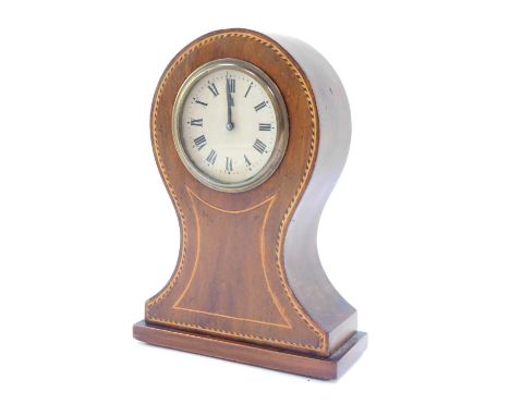 An Edwardian mahogany and line inlaid mantel clock, the circular dial bearing Roman numerals, clockwork movement by the Hambu