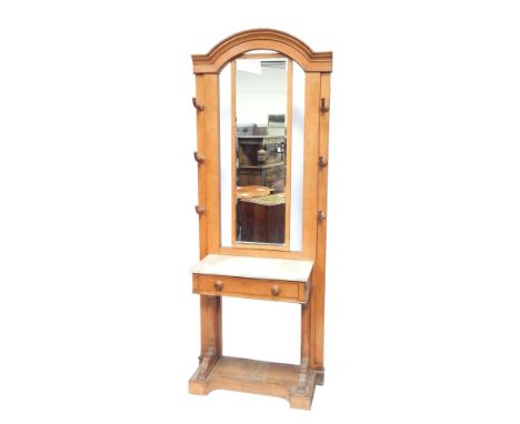 A late 19thC Continental light oak marble topped hall stand, the rectangular bevelled mirror back, with arrangement of six ho
