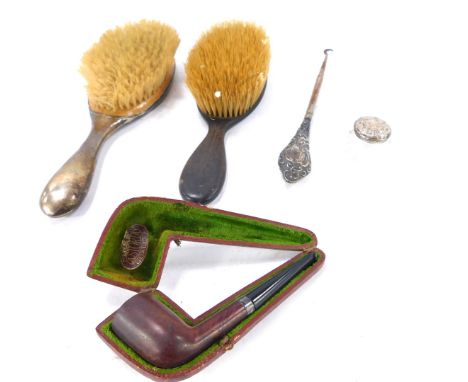 A group of silver dressing table jewellery, comprising a wooden handled and scroll silver inset hand mirror, a white metal ha