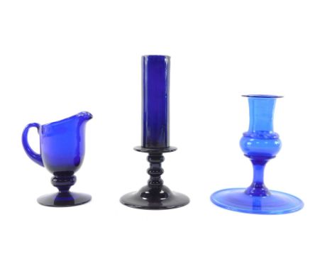 A 19thC Bristol blue glass candlestick, 17cm high, further blue glass candlestick  on a broad circular base with inverted rim