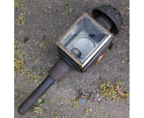A carriage lantern, black metal casing, with two glazed panel section, unmarked, 46cm high.