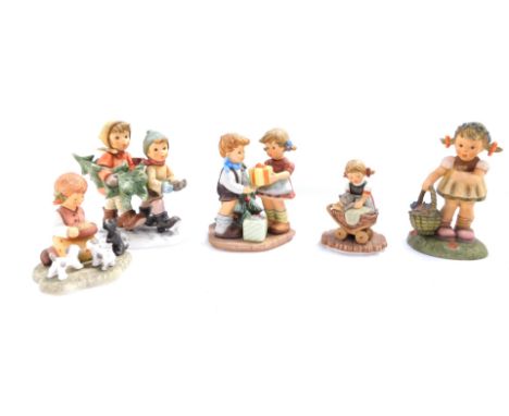 A group of Hummel figures, comprising Bowlful of Love, Tree Trimming Time, A Present for You, Spring Blossoms, and Snuggle Up