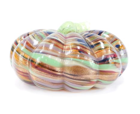 A Murano style glass model of a pumpkin, of fluted form, with spiral twist branch handle, having banded and gold aventurine d