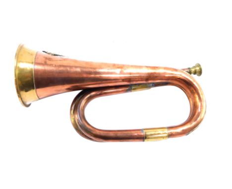An early 20thC military copper and brass bugle, with applied swan crest for the Western Australian University Regiment, 30cm 