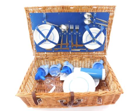 A 1970's/1980's picnic hamper, with contents of Brexton flask, and Melamine four place setting, etc, wicker basket with brown