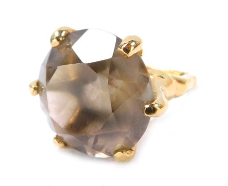 A smoky quartz dress ring, on a 22ct gold plated band and frame, boxed.