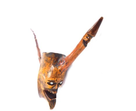 A late 19thC Continental carved wooden pipe of novelty figural form, 61cm wide.