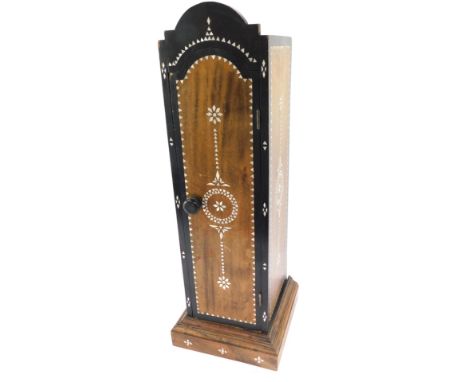 A Middle Eastern table spice cabinet, with mother of pearl inlaid and an arched top, 56cm high, 28cm wide, 18cm deep.