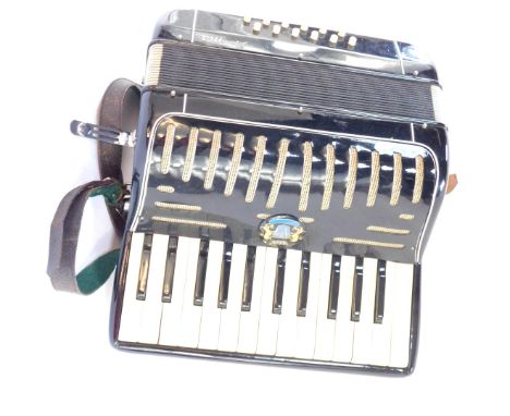 A Prima piano accordion, in travel case.