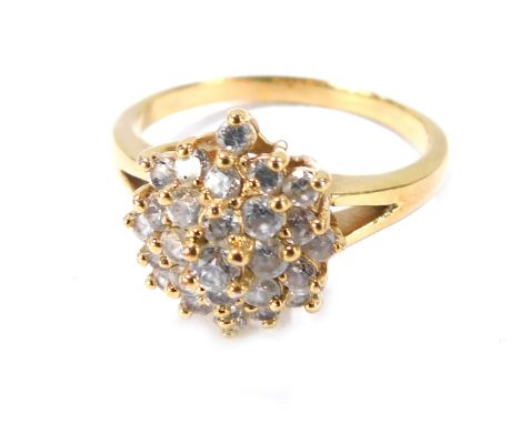 A plated dress ring, the central star design set with paste stones on V splayed shoulders, on a plated band, size X½.