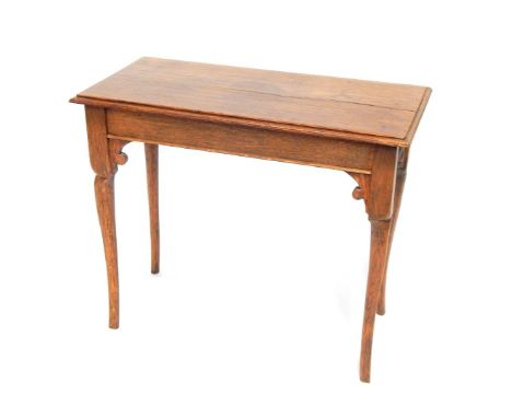 A light oak side table, with rectangular top, shaped and reeded legs, 57cm high, 70cm wide, 36cm deep.