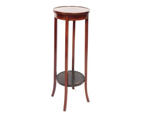 An Edwardian mahogany two tier plant stand, with parquetry two ring banding, on out splayed legs, 96cm high, 33cm diameter.