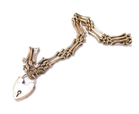 A 9ct rose gold gate bracelet, of three bar design, with safety chain and padlock, 11.1g, 20cm long. (AF)
