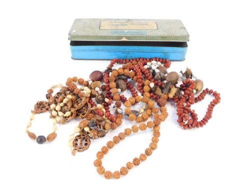 An Adaptorplast vintage First Aid tin, and a group of beaded nut necklaces. (a quantity)