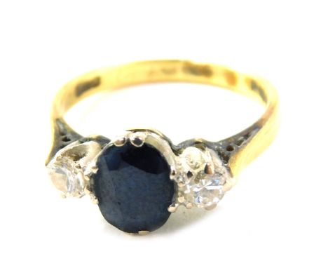 An 18ct gold sapphire and diamond dress ring, the oval sapphire in claw setting, flanked by two diamonds, each approx 0.15ct,