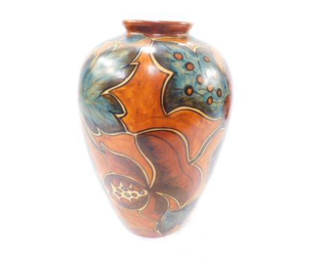 An early 20thC Clews Chameleon ware vase, decorated with stylised flowers against a light brown ground, No 234, impressed pri