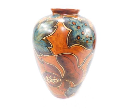 An early 20thC Clews Chameleon ware vase, decorated with stylised flowers against a light brown ground, No 234, impressed pri