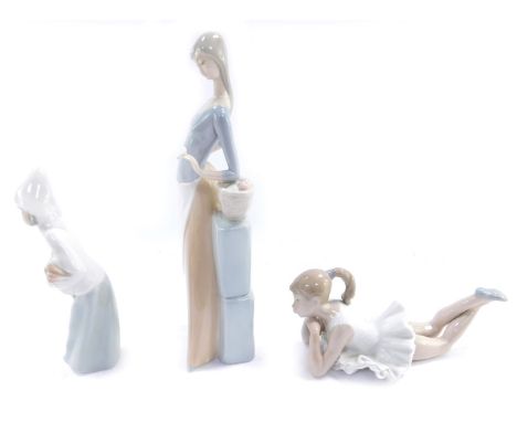 Three Nao and Lladro figures, comprising a Lladro figure of a child carrying a hen, 20cm high, a Nao figure of a seated balle