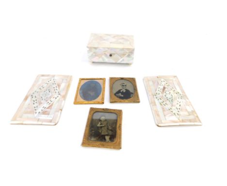 A Victorian mother of pearl rectangular box, two mother of pearl inlaid book covers, one engraved Jerusalem, and three daguer