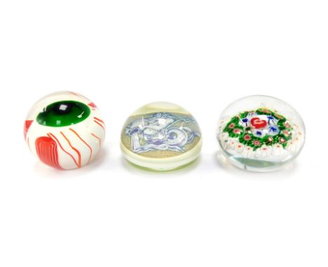 A Murano Azelaic style paperweight, decorated with Neptune, bears paper label, 10cm wide, a concentric millefiori paperweight