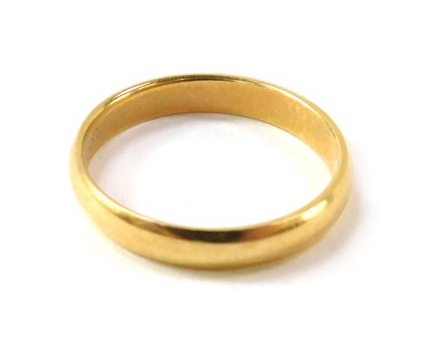 A wedding band, of plain design, stamped ARGYCR, size K.