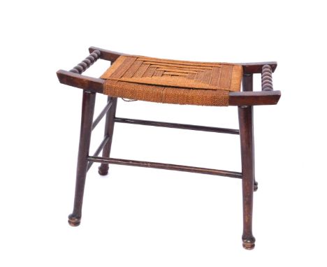 An early 20thC oak rush seated Arts &amp; Crafts Thebes type stool, with bobbin turned handles on out splayed legs, 50cm high