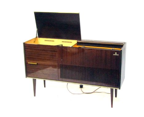 A Grundig radiogramme, in a glossed mahogany case, with Grundig automatic record player, on tapered legs, 74cm high, 122cm wi