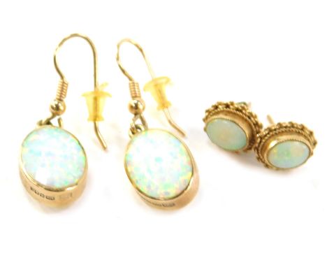 A pair of 9ct gold opal drop earrings, each 3cm high, together with a pair of single stud opal earrings, in 9ct gold frame, 6