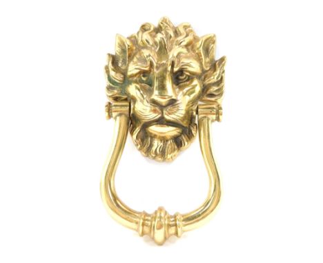 A 19thC brass door knocker, formed with a lion mask handle, 23cm high.