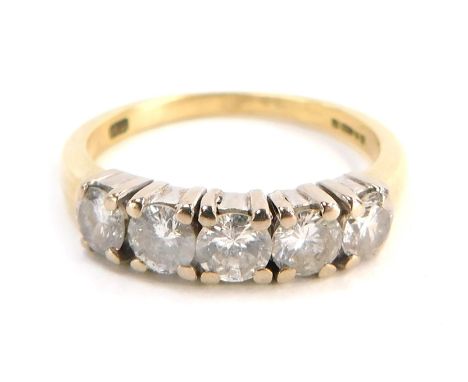 An 18ct gold diamond five stone dress ring, set with five round brilliant cut stones, each approx 0.25cts, totalling approx 1