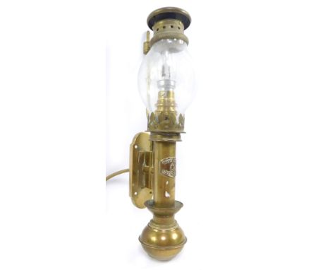 A White Star brass gimbal oil lamp, wall mounted, converted to electricity, 22.5cm high.