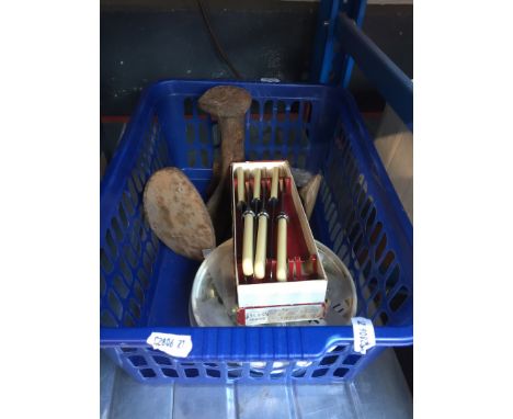 A crate with last, ceramic door/window knobs and a set of knives 