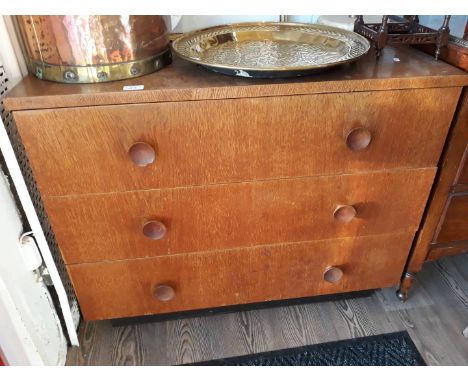 A light oak retro chest of 3 drawers with round handles 