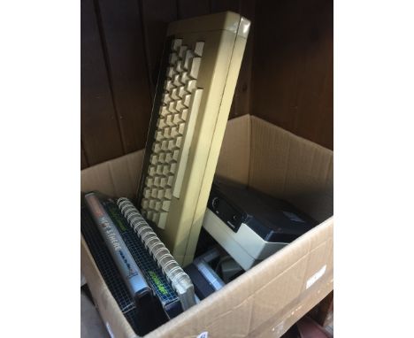 A box containing Acorn computer system with games and manual 