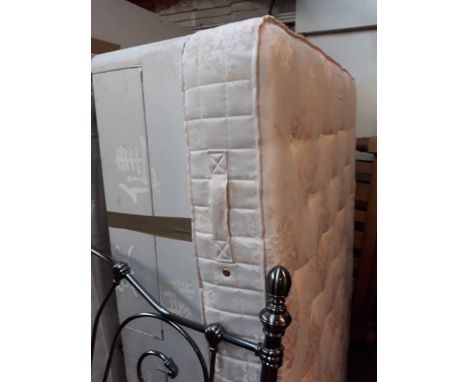 A light pink double mattress 