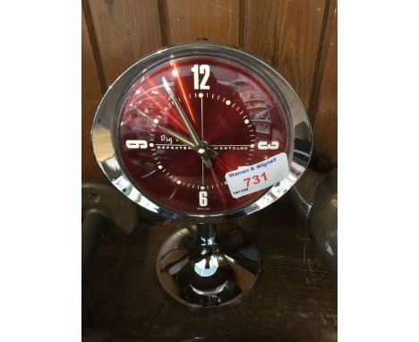 A 'Big Ben' red and chrome alarm clock. 